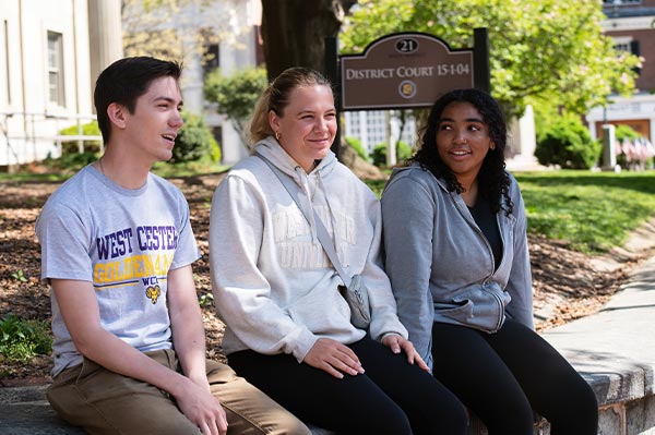 3 WCU students sitting in the borough of West Chester