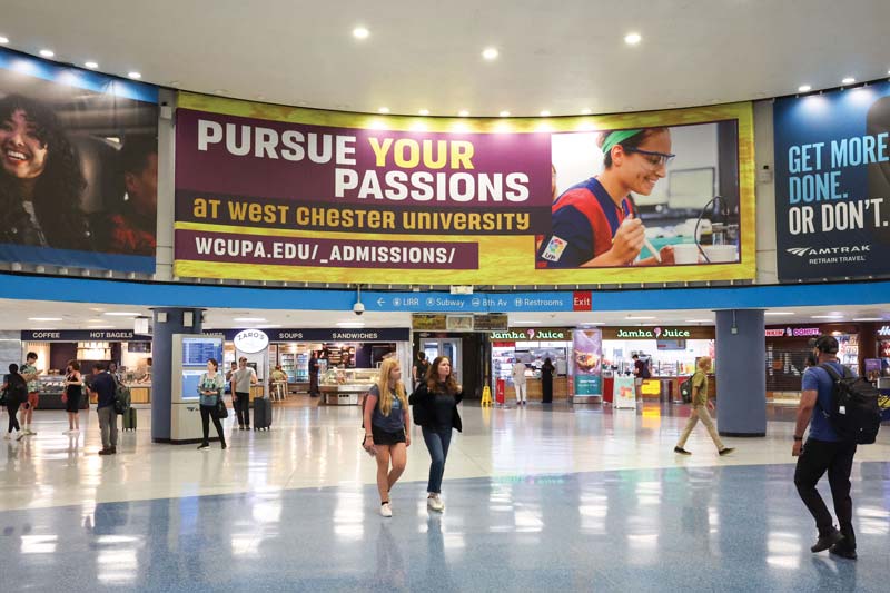 WCU advertising dominates Penn Station in New York City.