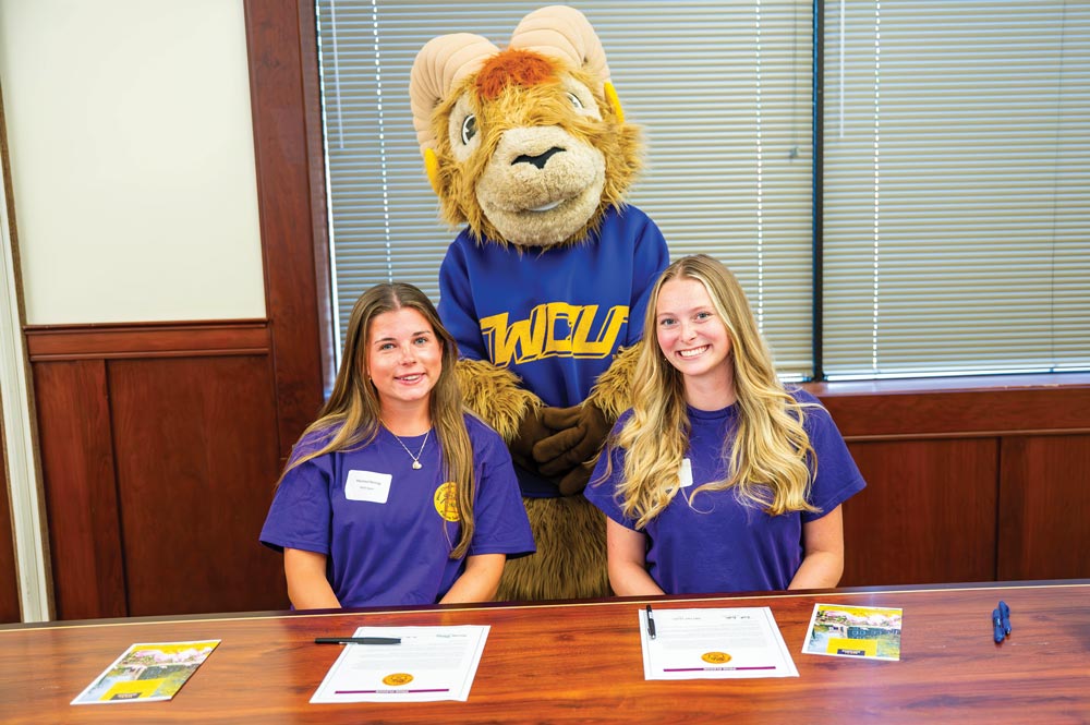 Rammy joins aspiring teachers Marissa Herring (L) and Faith Bullen (R) at the 2025 PRIZE signing ceremony.