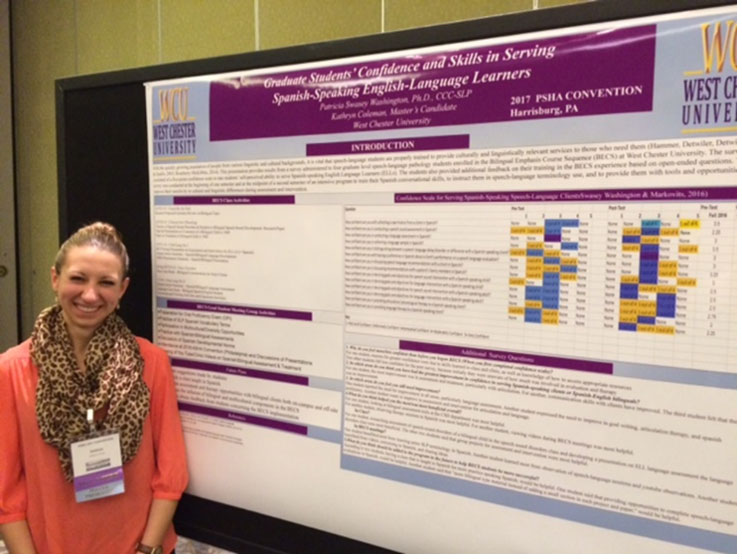 Woman standing in front of a presentation poster.